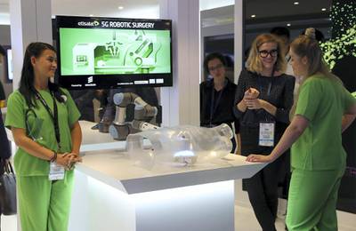 DUBAI , UNITED ARAB EMIRATES , OCT 10   – 2017 :- Visitors looking at the 5G Robotic Surgery which is on display at the Etisalat stand during the GITEX Technology Week held at Dubai World Trade Centre in Dubai. (Pawan Singh / The National ) Story by Nicholas Webster 