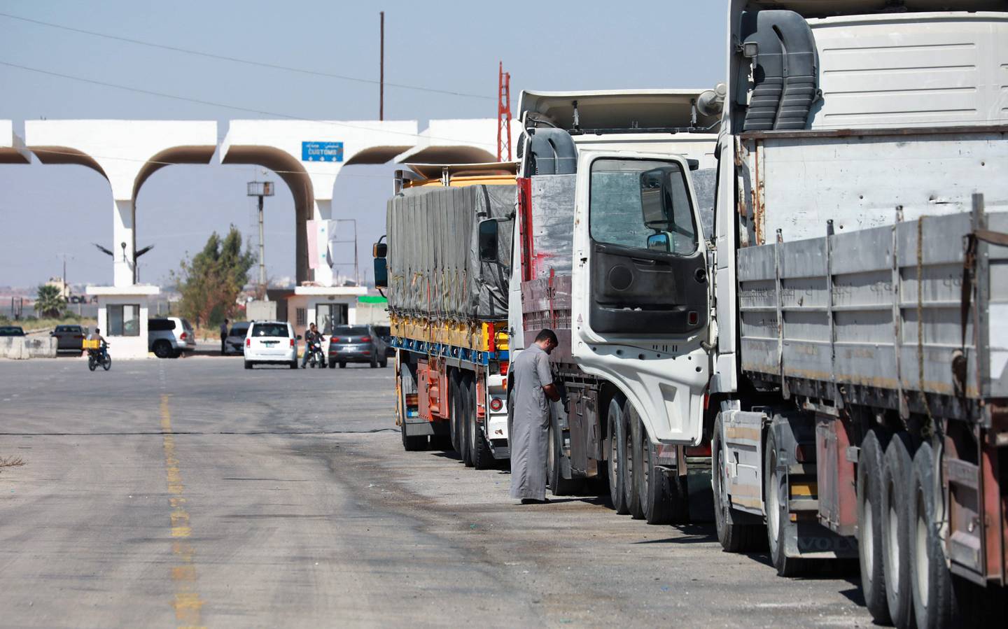 Trucks wait to enter Jordan through the Nassib-Jaber border post. AFP
