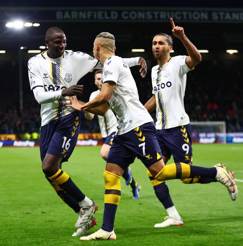 Richarlison celebrates with Dominic Calvert-Lewin and Abdoulaye Doucoure after scoring his second penalty. Getty