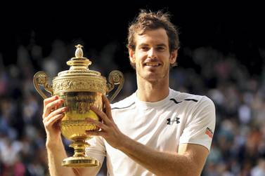 LONDON, ENGLAND - JULY 10: Andy Murray of Great Britain lifts the trophy following victory in the Men's Singles Final against Milos Raonic of Canada on day thirteen of the Wimbledon Lawn Tennis Championships at the All England Lawn Tennis and Croquet Club on July 10, 2016 in London, England. (Photo by Julian Finney/Getty Images)
