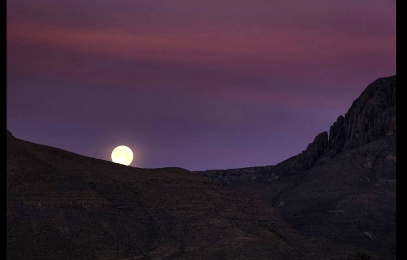 A full moon rises over the Guadalupe Mountains as seen from downtown Van Horn, Texas. Photo: Steve Lange