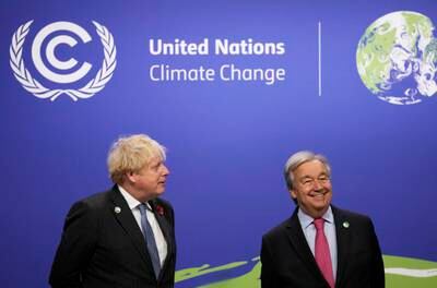 Boris Johnson speaks to UN Secretary General Antonio Guterres as leaders arrive at the Cop26 summit in Glasgow. AP
