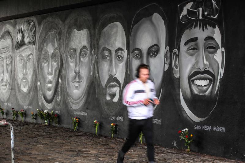 A man runs in front of a mural in Frankfurt. AFP