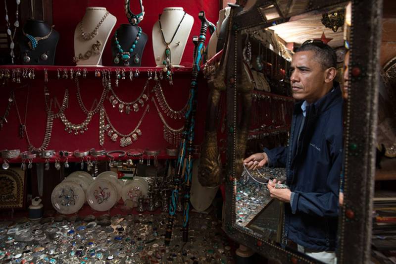 Mr Obama looks at jewellery at a shop before a walking tour of the ancient city of Petra in Jordan, March 23, 2013. Photo courtesy of the National Archives