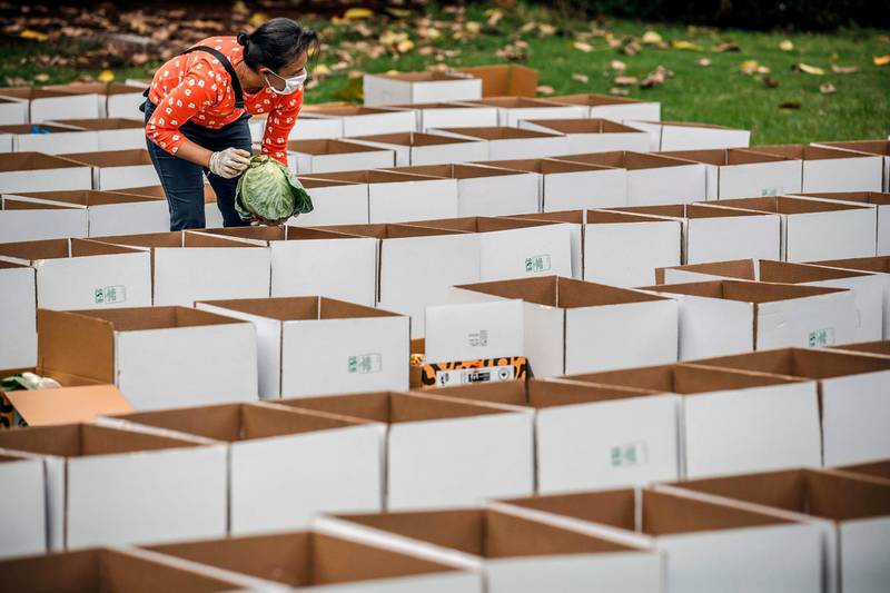 Aid boxes prepared by a volunteer to be delivered in the slums in Nairobi, Kenya on March 28. Luis Tato / AFP