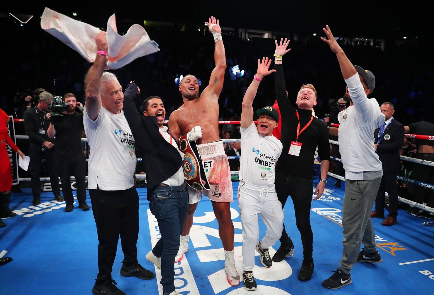 Joe Joyce celebrates with his team after stopping Joseph Parker. Getty