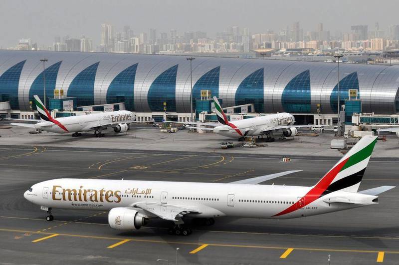 Emirates airline's first-half profit took a hit from rising fuel costs and a stronger dollar. Adam Schreck / AP