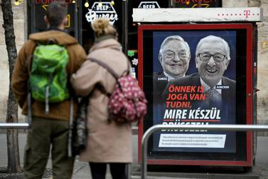 A government poster is seen in Budapest, Hungary, February 21, 2019. The poster reads, 'You also have the right to know what Brussels is up to', accusing European Commission President Jean-Claude Juncker of pushing migration plans encouraged by U.S.-Hungarian businessman George Soros, in a media campaign rebuked by the commission. Reuters