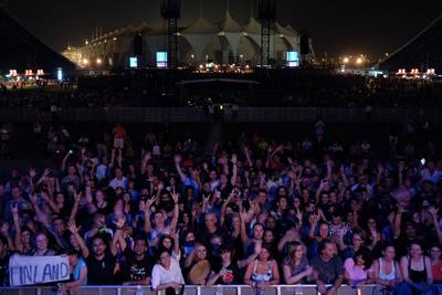 Early fans patiently await the start of the Bon Jovi concert at Du Arena in Abu Dhabi on Thursday. Delores Johnson / The National