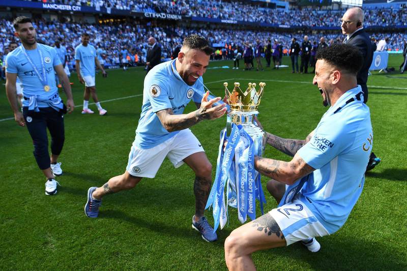 Nicolas Otamendi and Kyle Walker celebrate winning the Premier League title. Michael Regan / Getty Images