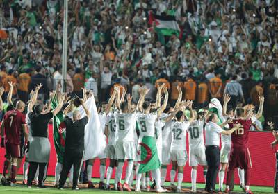 Algeria's players acknowledge their fans in Cairo. EPA
