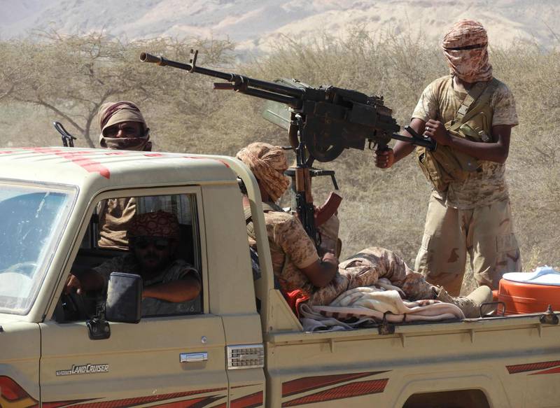 Yemeni fighters loyal to the government backed by the Saudi-led coalition fighting in the country ride in the back of a pickup truck with mounted heavy machine gun while closing in on a suspected location of an Al-Qaeda in the Arabian Peninsula (AQAP) leader during their the offensive in the Mesini Valley in the vast province of Hadramawt on February 21, 2018.
Yemeni special forces trained by the United Arab Emirates -- a key member of a Saudi-led alliance fighting alongside Yemen's government forces -- had in the previous week launched the offensive, codenamed "Al-Faisal", against Al-Qaeda cells in oil-rich Hadramawt province.
Two soldiers were killed on February 17 in the offensive, which targets the Mesini and Amed Valleys in Hadramawt and which are critical in the control over Yemen's southeastern coastline. / AFP PHOTO / SALEH AL-OBEIDI