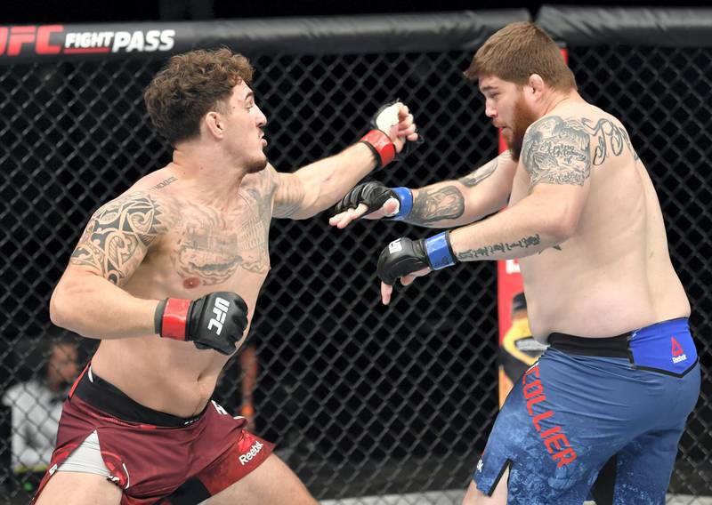 ABU DHABI, UNITED ARAB EMIRATES - JULY 26: (L-R) Tom Aspinall of England punches Jake Collier in their heavyweight fight during the UFC Fight Night event inside Flash Forum on UFC Fight Island on July 26, 2020 in Yas Island, Abu Dhabi, United Arab Emirates. (Photo by Jeff Bottari/Zuffa LLC via Getty Images) *** Local Caption *** ABU DHABI, UNITED ARAB EMIRATES - JULY 26: (L-R) Tom Aspinall of England punches Jake Collier in their heavyweight fight during the UFC Fight Night event inside Flash Forum on UFC Fight Island on July 26, 2020 in Yas Island, Abu Dhabi, United Arab Emirates. (Photo by Jeff Bottari/Zuffa LLC via Getty Images)