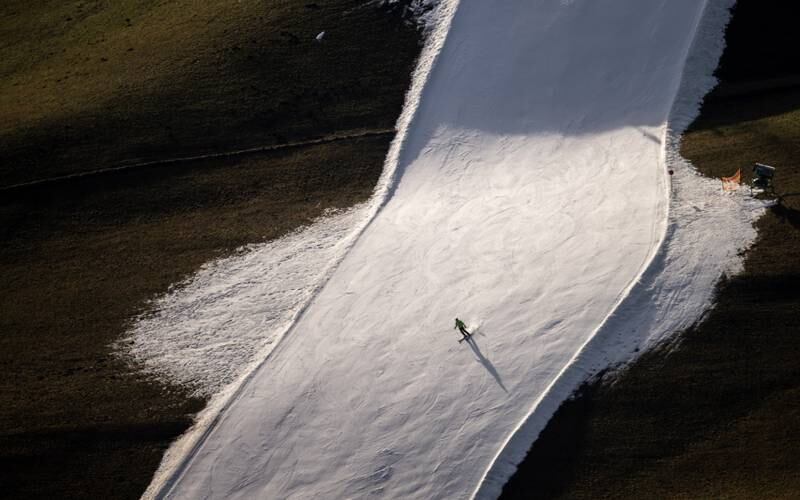 A skier on a slope in an otherwise snowless Schladming, Austria. EPA