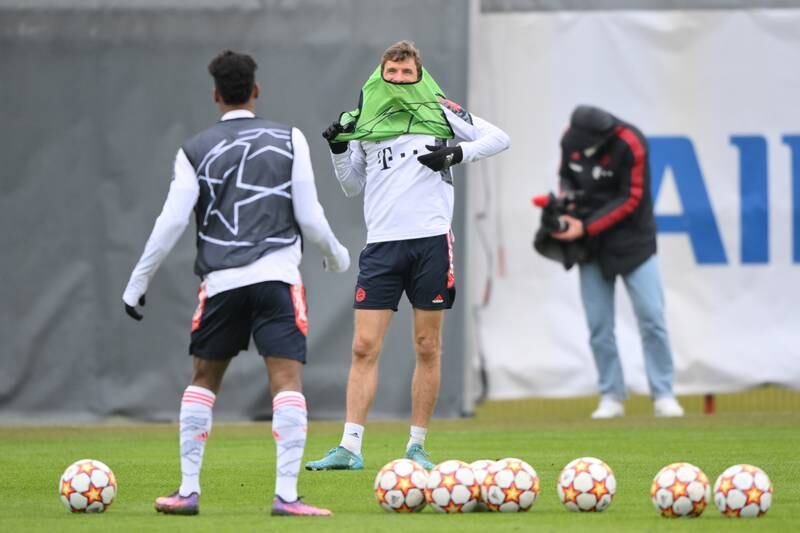 Bayern attacker Thomas Muller puts on a bib during training. Getty