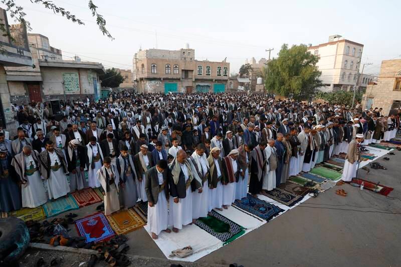 People attend Eid al-Fitr prayers outside a mosque in Sana'a, Yemen. EPA