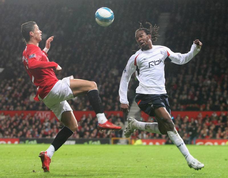 MANCHESTER, ENGLAND - MARCH 19:  Cristiano Ronaldo of Manchester United clashes with Ricardo Gardner of Bolton Wanderers during the Barclays FA Premier League match between Manchester United and Bolton Wanderers at Old Trafford on March 19 2008, in Manchester, England. (Photo by Tom Purslow/Manchester United via Getty Images)
