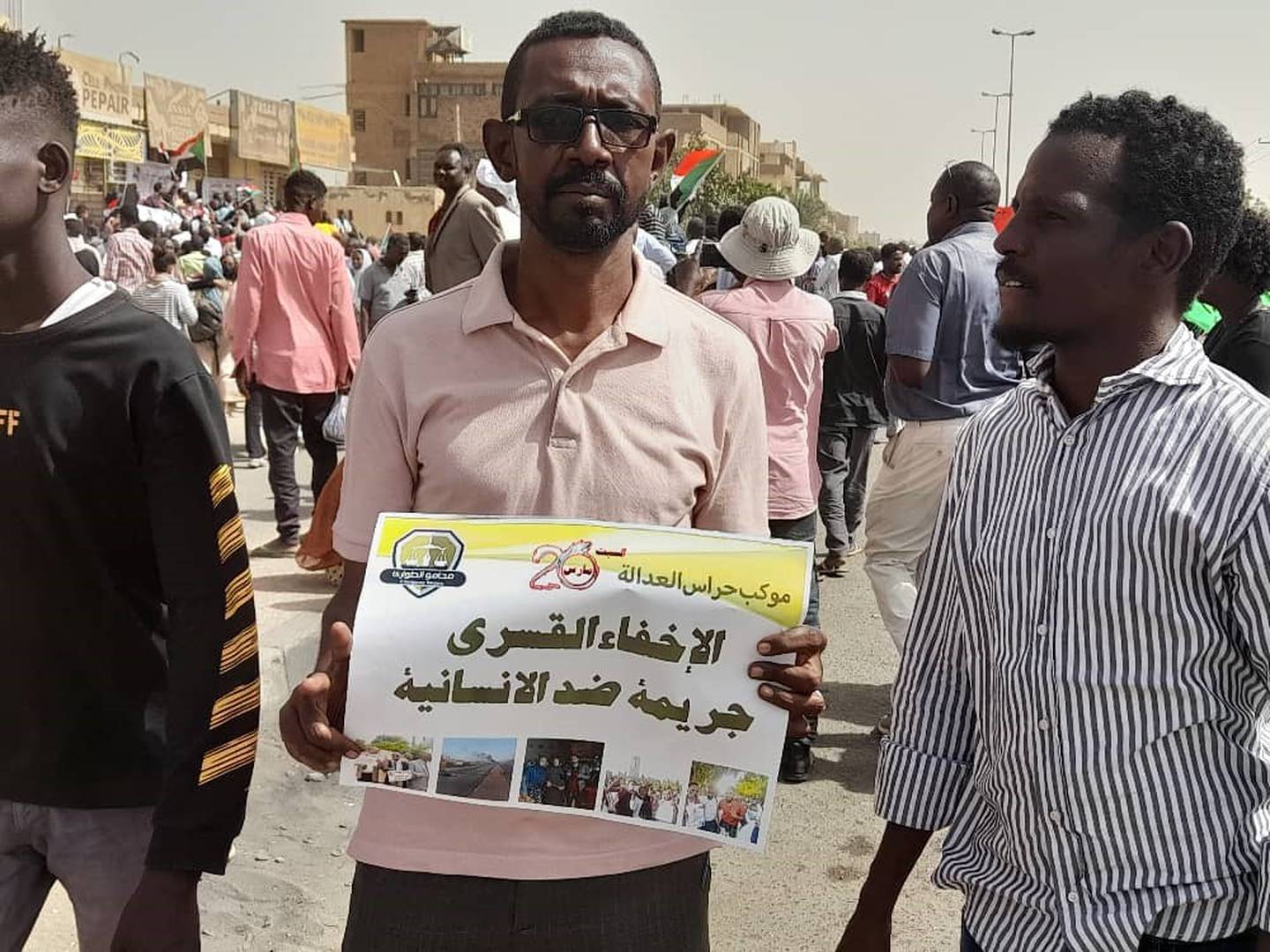 Khalid Bekheit carries a poster saying 'no to enforced disappearances'. The Sudanese lawyer says secret detentions are playing a critical role in the efforts to discourage dissent. Photo: Khalid Bekheit