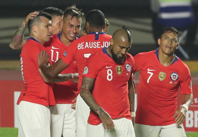 Chile's Eduardo Vargas celebrates scoring their second goal with teammates. Reuters