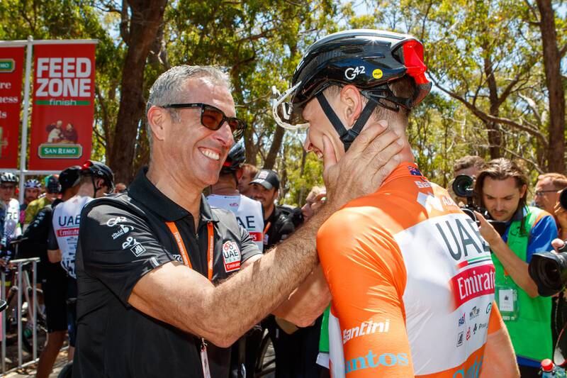 Jay Vine celebrates with UAE Team Emirates COO Andrea Agostini after winning the Tour Down Under. EPA