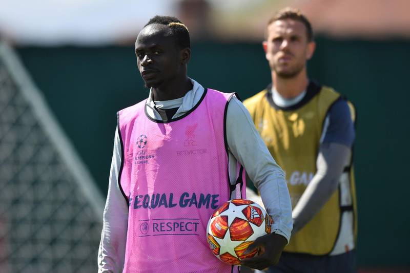 Liverpool's Senegalese striker Sadio Mane and Jordan Henderson. AFP
