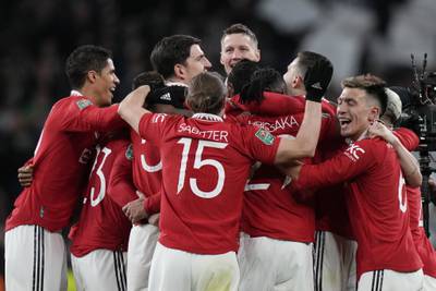 Manchester United players celebrate their victory. AP 