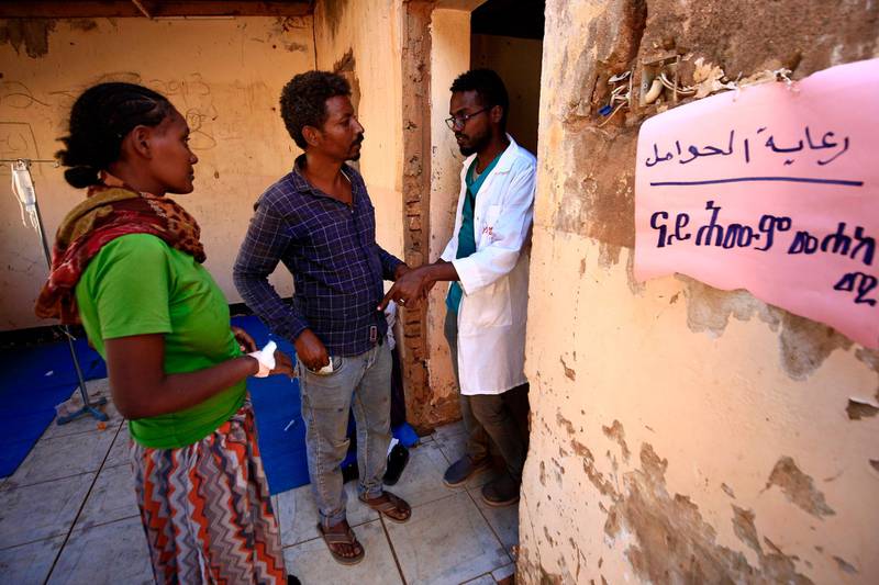 An Ethiopian woman who fled fighting in Tigray province receives prenatal care at a designated section of the Um Rakuba camp in Sudan's eastern Gedaref province. AFP