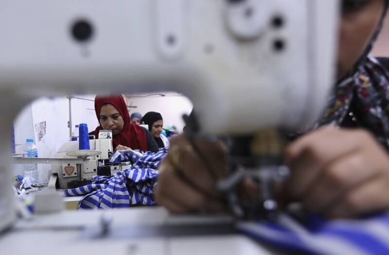 Women sew school uniforms inside a factory in northern Cairo’s Shubra El Kheima district, Egypt. Reuters