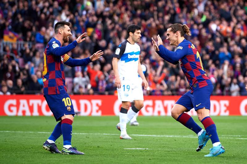 Antoine Griezmann of Barcelona celebrates with his teammate Lionel Messi. Getty