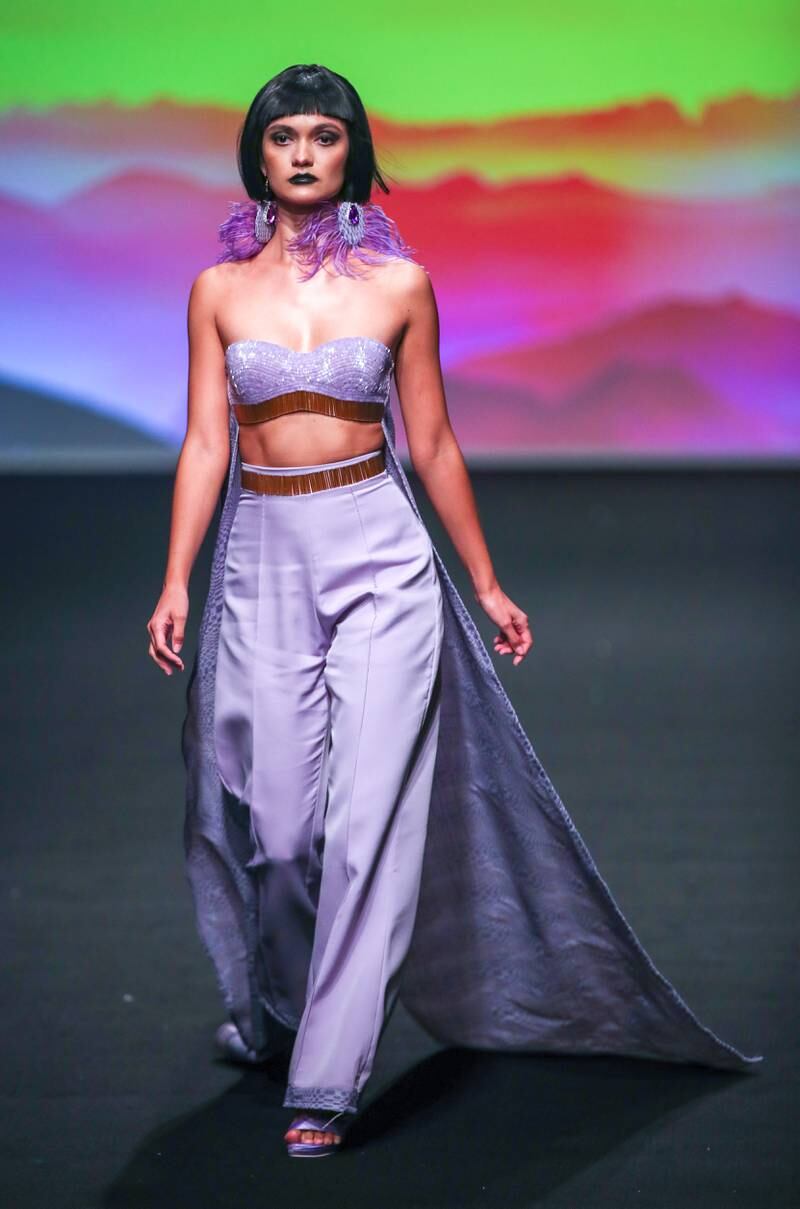 A model walks the runway for Rian Fernandez at Arab Fashion Week. 