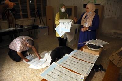 Iraqi election committee staff members count votes to elect 329 new members of the Council of Representatives. EPA