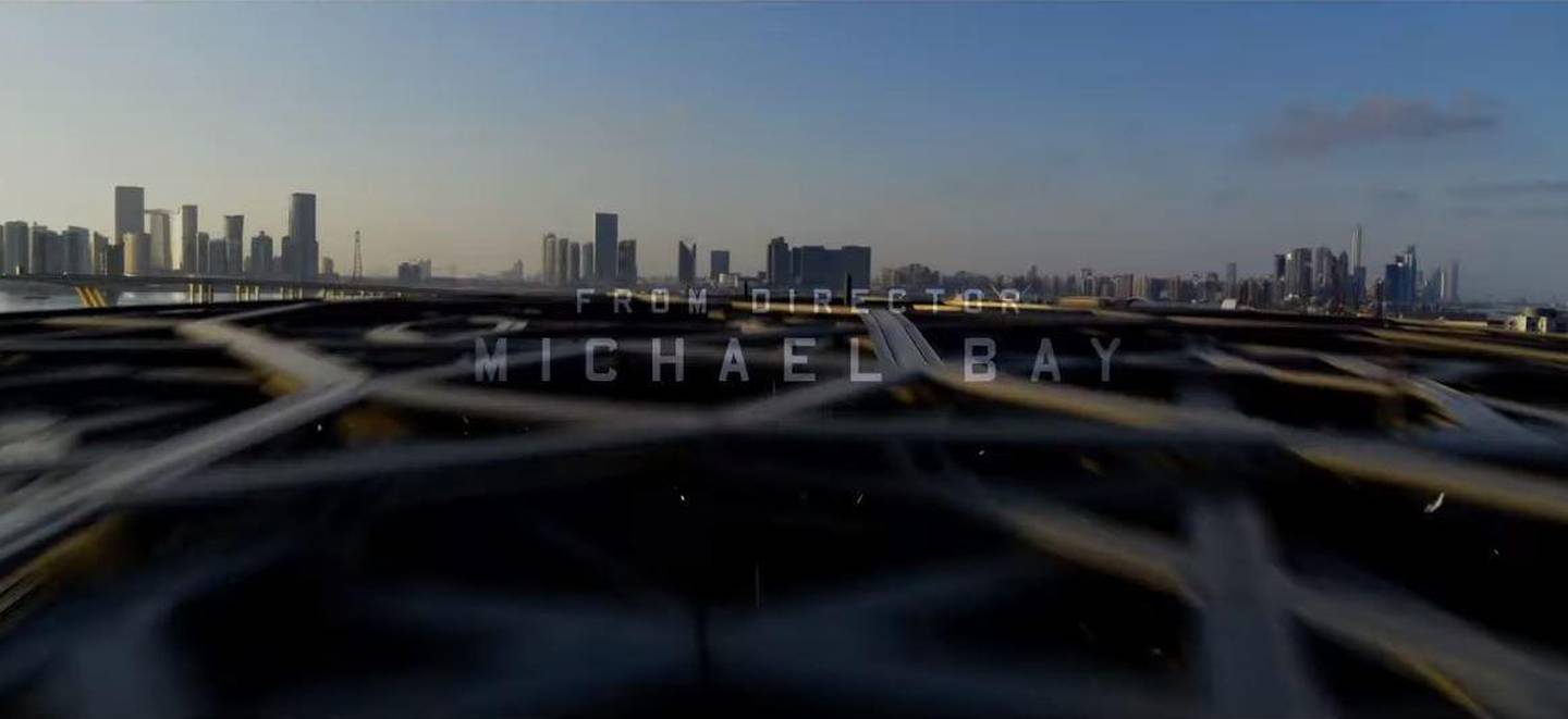 The opening credits of the '6 Underground' trailer pan over Louvre Abu Dhabi's dome, with the capital's skyline visible in the background. YouTube / Netflix