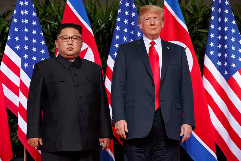 FILE - In this June. 12, 2018, file photo, U.S. President Donald Trump meets with North Korean leader Kim Jong Un on Sentosa Island, in Singapore. President Donald Trump had previously condemned the cruelty of North Koreaâ€™s government, but after his historic summit on Tuesday with North Korean leader Kim Jong Un, Trump seemed to play down the severity of human rights violations in North Korea. (AP Photo/Evan Vucci, File)