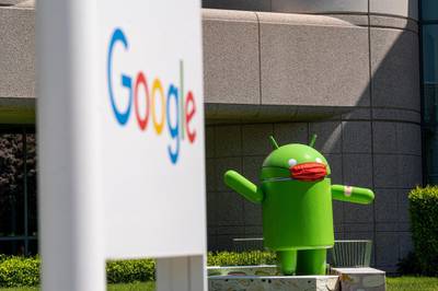 An Android statue wearing a mask on the Google campus in Mountain View, California, U.S., on Wednesday, April 21, 2021. Silicon Valley has the lowest office vacancy rate in the U.S., even as technology companies embrace remote work. Photographer: David Paul Morris/Bloomberg