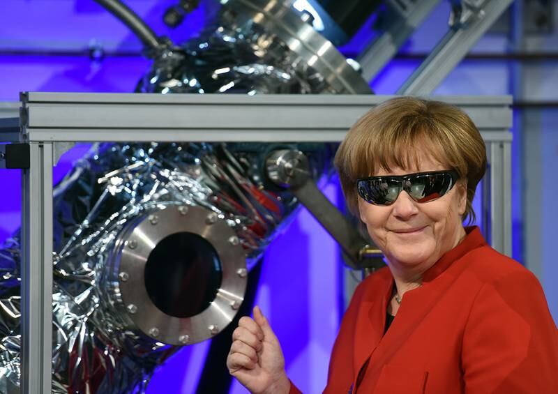 Mrs Merkel wears safety goggles during a visit to the European Astronauts Centre in Cologne, in 2016. Getty Images