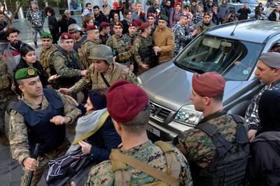 Lebanese army soldiers clash with anti-government protesters as they attempt to block a road leading to the parliament building to protest parliament meeting in downtown Beirut.  EPA