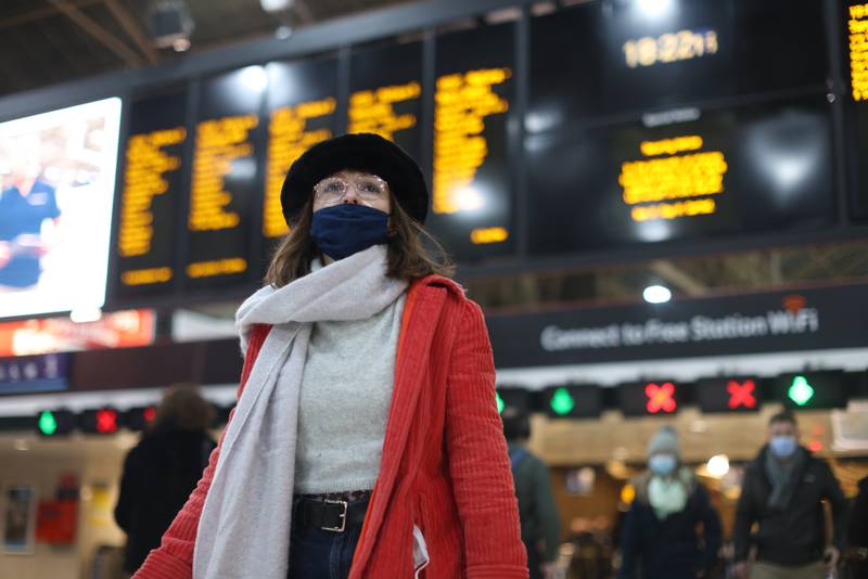 A passenger wears a mask at Charring Cross Station. PA