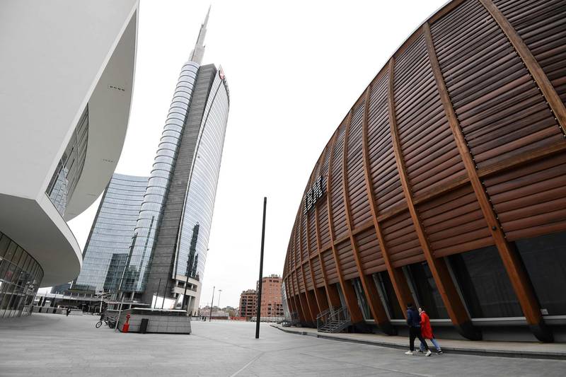 People go about Piazza Gae Aulenti in Milan. AFP