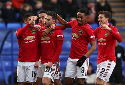 Soccer Football -  FA Cup Fourth Round - Tranmere Rovers v Manchester United - Prenton Park, Birkenhead, Britain - January 26, 2020  Manchester United's Diogo Dalot celebrates scoring their second goal with teammates      REUTERS/Scott Heppell