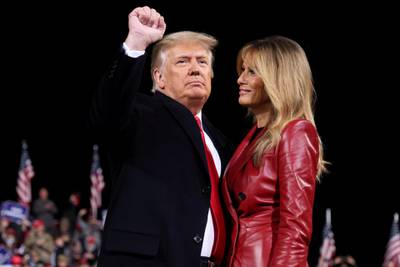 US President Donald Trump gestures next to first lady Melania Trump after speaking at a campaign event for Republican US senators David Perdue and Kelly Loeffler in Valdosta, Georgia, US. Reuters
