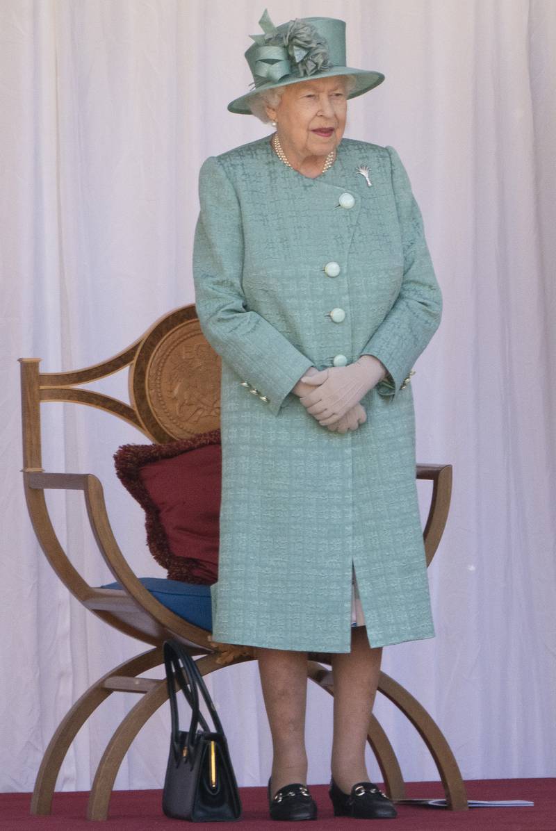 Queen Elizabeth II, in light green, attends a ceremony to mark her official birthday at Windsor Castle on June 13, 2020. Getty Images