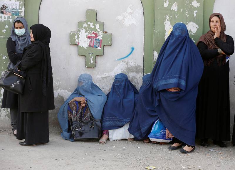 Afghan women line up to cast their votes during a parliamentary election at a polling station in Kabul, Afghanistan, October 20, 2018. REUTERS/Omar Sobhani