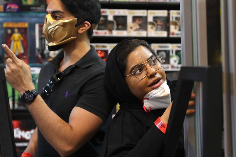 People wear face masks during the Middle East Comic Con. AP Photo
