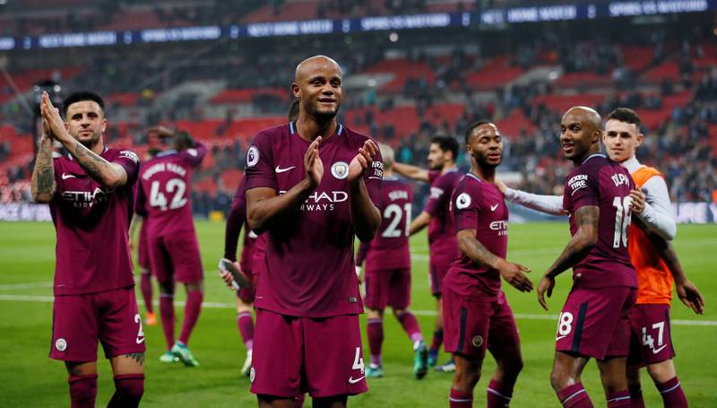 Soccer Football - Premier League - Tottenham Hotspur vs Manchester City - Wembley Stadium, London, Britain - April 14, 2018   Manchester City's Vincent Kompany and teammates applaud the fans after the match    REUTERS/David Klein    EDITORIAL USE ONLY. No use with unauthorized audio, video, data, fixture lists, club/league logos or "live" services. Online in-match use limited to 75 images, no video emulation. No use in betting, games or single club/league/player publications.  Please contact your account representative for further details.