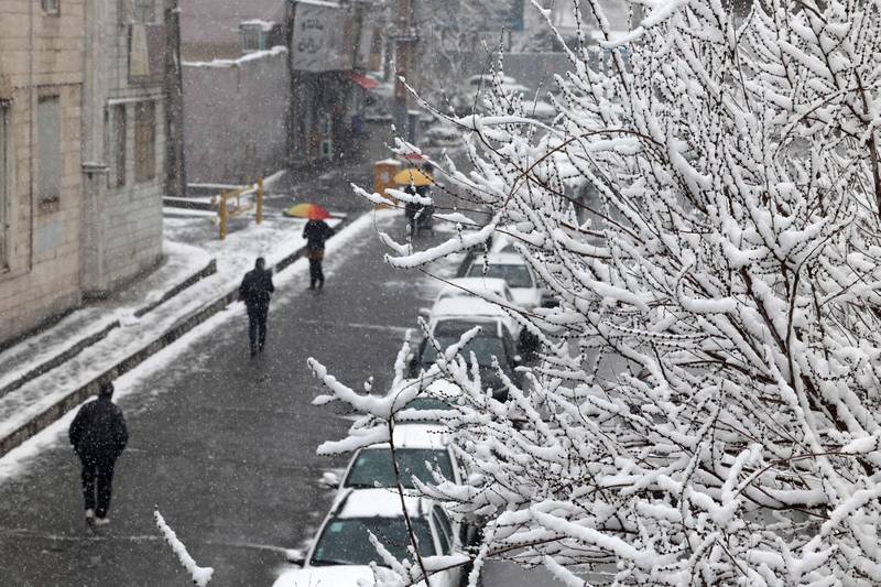 A Tehran street during snowfall in the Iranian capital. AFP