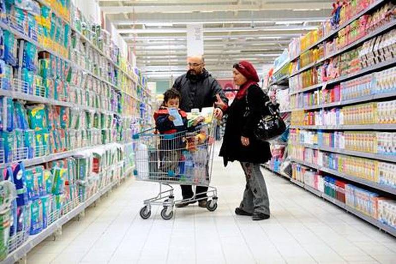 GENERIC CAPTION!!! Tunisians shop in the newly opened Tunisian-French Geant Hypermarket in Tunis on January 12, 2012. The 12,000 square meter hypermarket opened today in the mall recently rebuilt. The supermarket was burned and robbed on January 14, 2011 the day President Ben Ali was ousted.  A year after they ousted a dictator and gave birth to the Arab Spring, Tunisians are still battling pressing social and economic problems but now under democratically-elected rulers. AFP PHOTO / FETHI BELAID