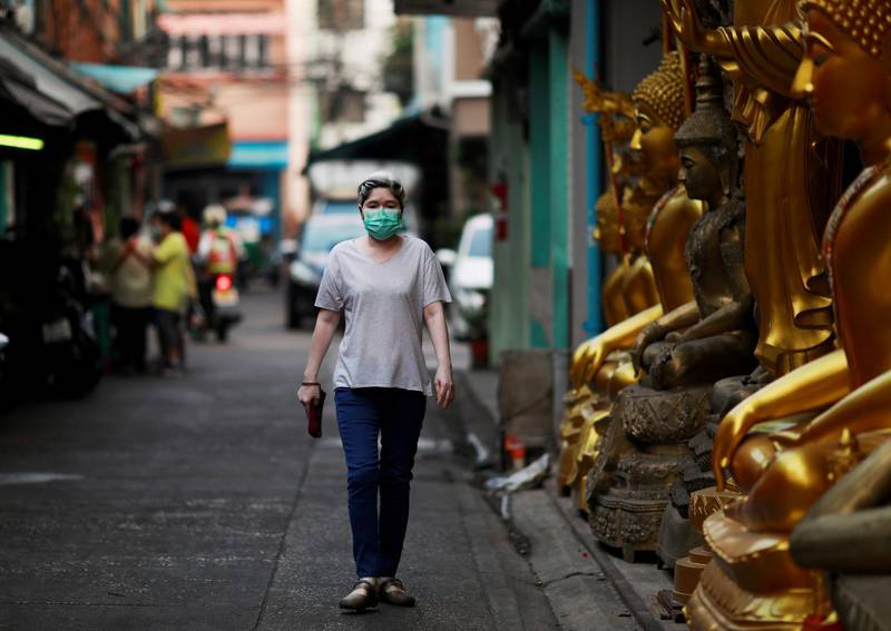 A woman wears a mask as a preventive measure against the coronavirus outbreak, in Bangkok, Thailand. Reuters