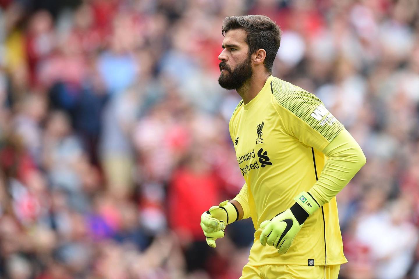 Liverpool's Brazilian goalkeeper Alisson Becker makes his Premier League debut during the English Premier League football match between Liverpool and West Ham United at Anfield in Liverpool, north west England on August 12, 2018. (Photo by Oli SCARFF / AFP) / RESTRICTED TO EDITORIAL USE. No use with unauthorized audio, video, data, fixture lists, club/league logos or 'live' services. Online in-match use limited to 120 images. An additional 40 images may be used in extra time. No video emulation. Social media in-match use limited to 120 images. An additional 40 images may be used in extra time. No use in betting publications, games or single club/league/player publications. / 