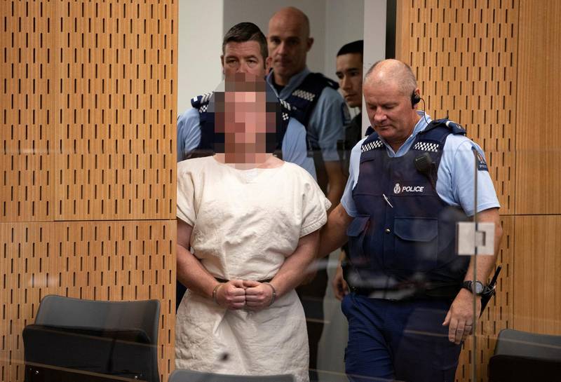 Brenton Tarrant, charged for murder in relation to the mosque attacks, is lead into the dock for his appearance in the Christchurch District Court, New Zealand March 16, 2019.   Mark Mitchell/New Zealand Herald/Pool via REUTERS. ATTENTION EDITORS - PICTURE PIXELATED AT SOURCE. SUSPECT FACE MUST BE PIXELATED. ONLY HIS FACE.