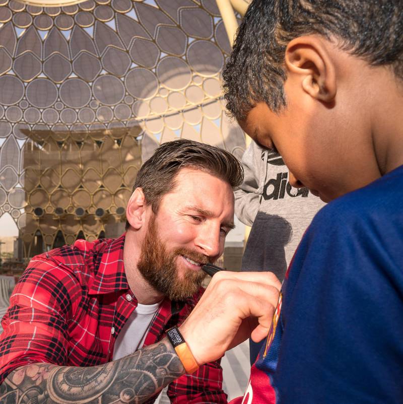Expo 2020 ambassador Lionel Messi signs shirts for UAE school pupils at Al Wasl Plaza at the Expo 2020 Dubai site. Courtesy Expo 2020 Dubai